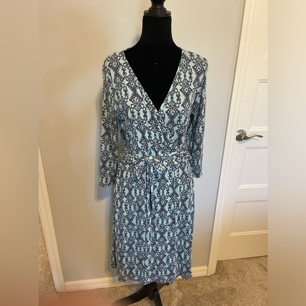 Faux wrap dress. Very comfortable fabric. Very pretty light green and gray.